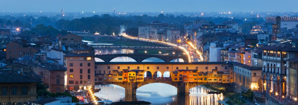 Florence, Italy night skyline. Ponte Vecchio bridge over Arno River.