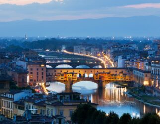 Florence, Italy night skyline. Ponte Vecchio bridge over Arno River.