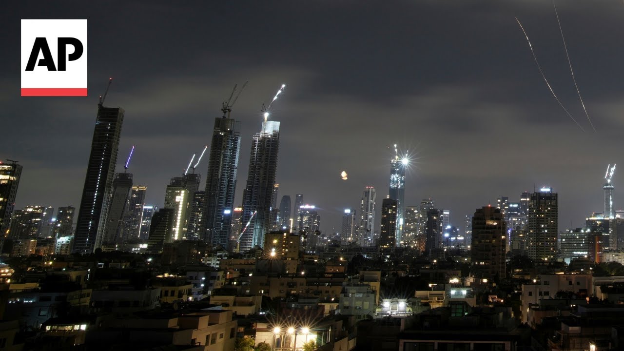 Israel intercepts Iran missiles over Tel Aviv as sirens sound