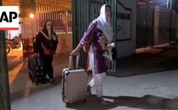 Pakistani families and students fleeing Iran arrive at border crossing